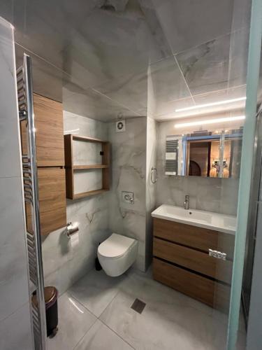 a bathroom with a toilet and a sink at Diamond Stay in Kilkís