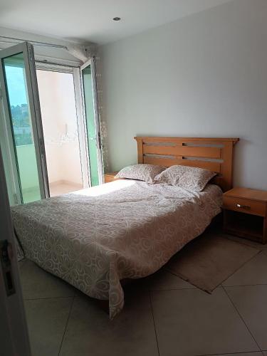 Ένα ή περισσότερα κρεβάτια σε δωμάτιο στο Pleasant apartment, ideal for your stays