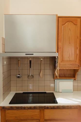 a kitchen with a sink and a counter top at やまぽっちYamapochi Cottage in Hakuba