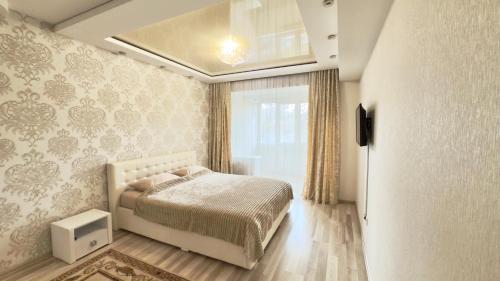 Giường trong phòng chung tại Lia*s Deluxe Apartment in the Center