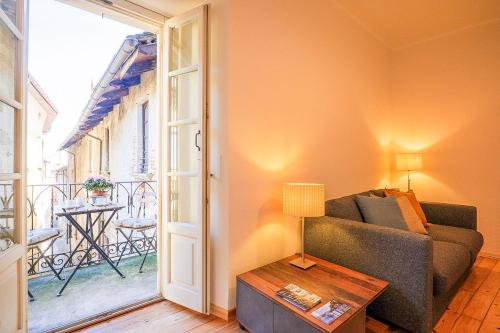a living room with a couch and a table at Casa Sofia in Cannobio