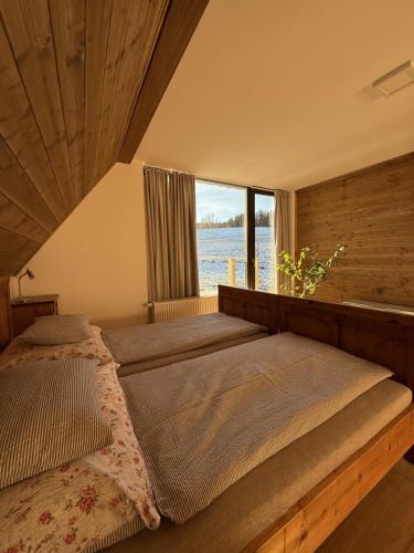 Postel nebo postele na pokoji v ubytování Chalupa Bartlův Dvůr