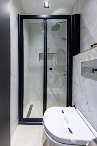 a bathroom with a toilet and a shower at Taksim Avenue in Istanbul