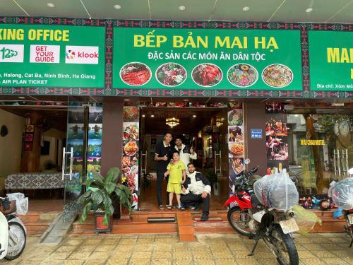 a store front of a restaurant with motorcycles parked outside at Mai Chau Hostel in Mai Chau