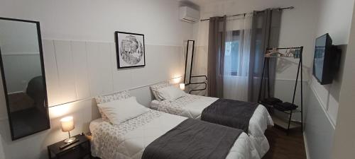 Een bed of bedden in een kamer bij Casa dos Andrades