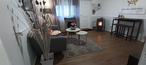 a living room with a couch and a table at Casa dos Andrades in Belmonte