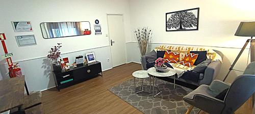 a living room with a couch and a table at Casa dos Andrades in Belmonte