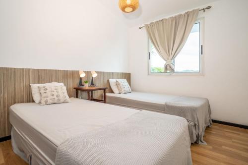 Postel nebo postele na pokoji v ubytování Piece of Paradise