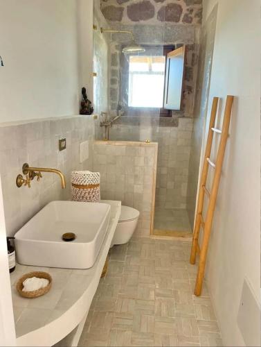 a bathroom with a sink and a toilet at Art Ryad space in El Jadida
