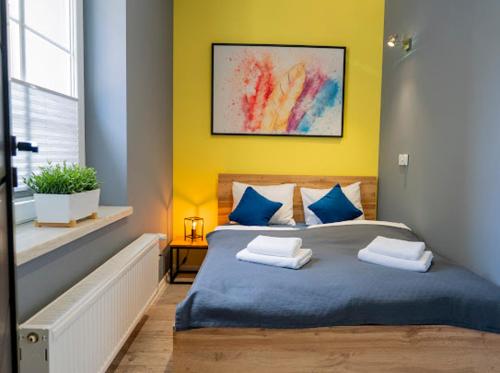 Postel nebo postele na pokoji v ubytování Zuzia Apartment - 50 m od Rynku