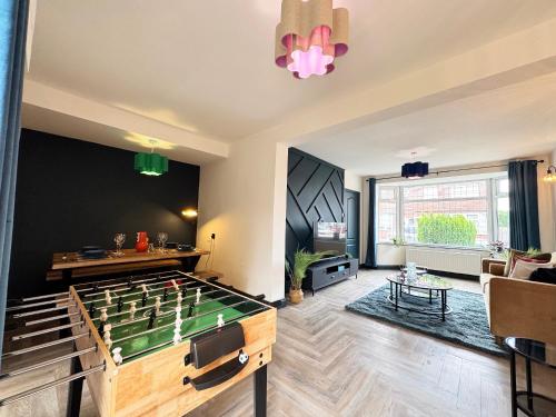 a living room with a pool table in the middle at Family & Pet-Friendly 5pp, Parking, 20 min to City in Manchester