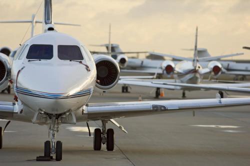a white airplane sitting on the runway at an airport at Country Inn & Suites by Radisson, Harrisburg West Mechanicsburg in Mechanicsburg