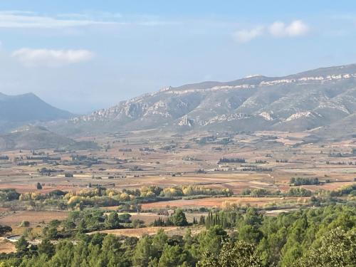 a view of a valley with mountains in the background at Chambre privée chez l'habitant, Les Maisons de Gaia in Tuchan