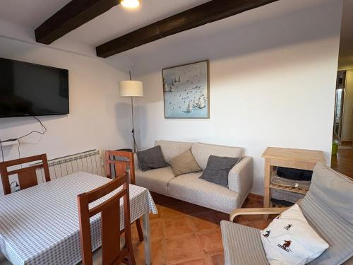 Een TV en/of entertainmentcenter bij Apartamento Nievesol con Parking y WiFi
