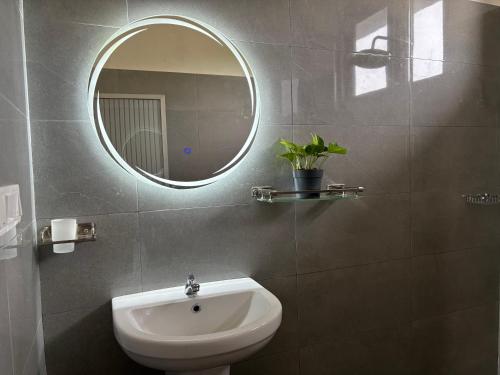 a bathroom with a sink and a mirror at Villa southern coast in Kamburugamuwa