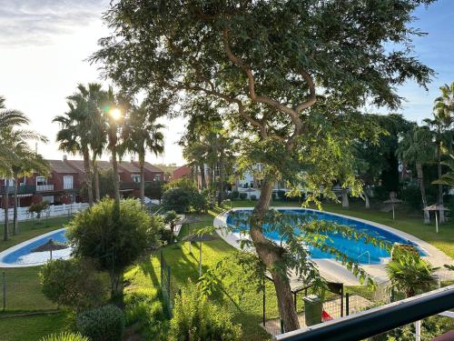 Swimmingpoolen hos eller tæt på Apartamento La Barrosa - Aldea del Coto