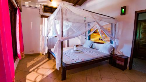 Postel nebo postele na pokoji v ubytování Villa Makoa