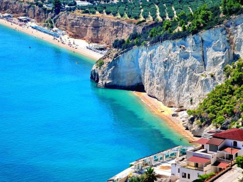 a view of a beach next to a cliff at La Piccola Casa in Mattinata