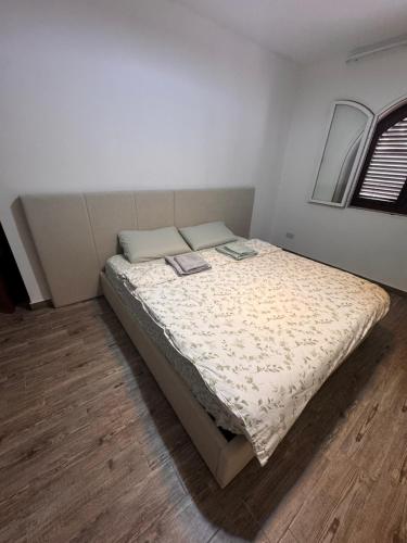 a bedroom with a bed with two books on it at Double bedroom with private bathroom in Pieta
