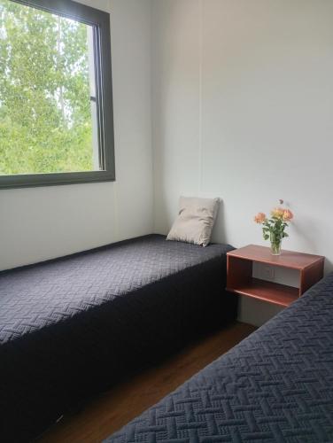 Ένα ή περισσότερα κρεβάτια σε δωμάτιο στο Container House