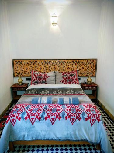 Postel nebo postele na pokoji v ubytování Dar Abdellah