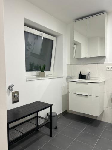 Η κουζίνα ή μικρή κουζίνα στο Smart Home Bad Camberg - moderne Ferienwohnung