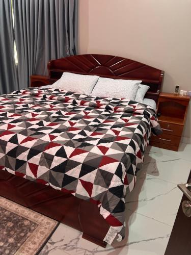 Ένα ή περισσότερα κρεβάτια σε δωμάτιο στο The Pears Apartment East Legon