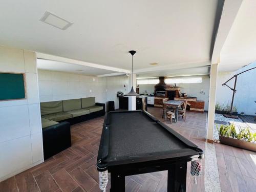 a living room with a ping pong table in it at CasaMare in Cariacica