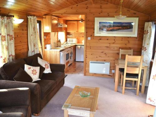 a living room with a couch and a table at Ashness in Keswick