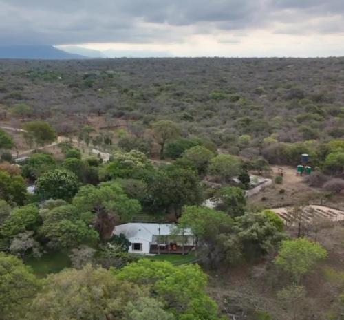 an aerial view of a house in the forest at Kruger Park Farmstay near Orpen Gate in Hoedspruit