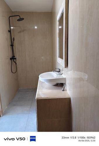 a bathroom with a sink and a shower at Villa kembar ungasan in Ungasan