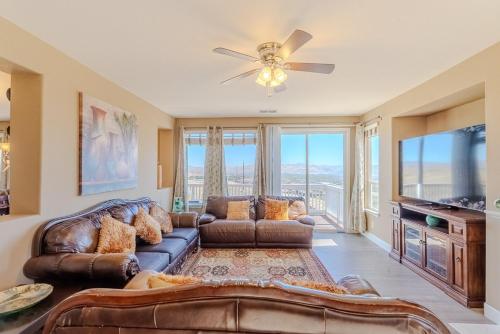 a living room with a couch and a flat screen tv at Sierra Vista Retreat - Reno Tahoe in Reno