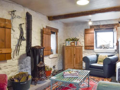 a living room with a couch and a table at Threshing Barn - Kza in Glaisdale