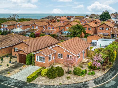 an aerial view of a residential neighborhood with houses at The Beach Bungalow in Beltinge
