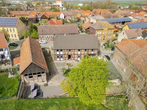 an aerial view of a town with buildings at Mario's fachwerkhaus am Huy in Schlanstedt