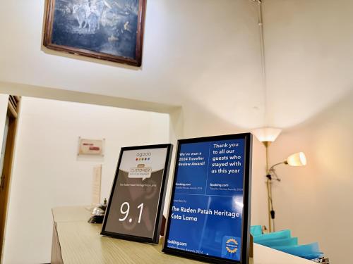 a sign on a table in a room at The Raden Patah Heritage Kota Lama Semarang in Semarang
