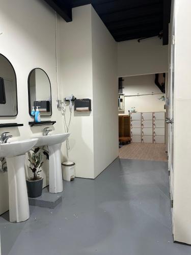 a bathroom with two sinks and a mirror at 流浪秘境Wanderland in Green Island