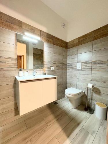 a bathroom with a sink and a toilet at B&B Fior di Feruci in Trenta