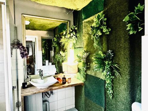 a bathroom with a sink and a mirror at Soul Oasis Urban Retreat in Centurion