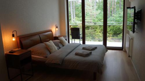 a bedroom with a bed with two towels on it at Mierki da Marco 