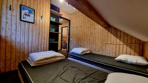 Ένα ή περισσότερα κρεβάτια σε δωμάτιο στο Le Loticeja