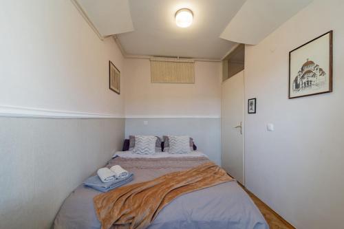 a small bedroom with two beds in it at Ada Home Belgrade Apartment 