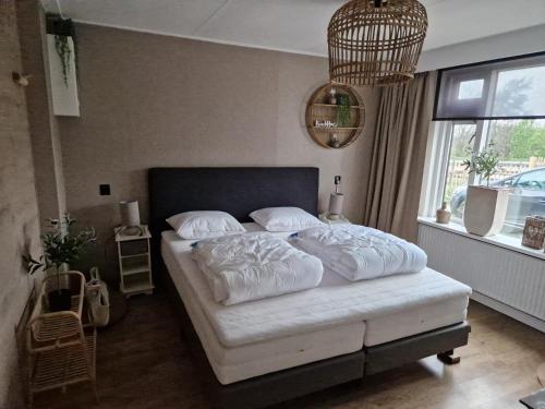 Ένα ή περισσότερα κρεβάτια σε δωμάτιο στο B&B Aan de Hoge Berg