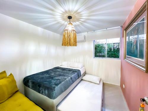 Ένα ή περισσότερα κρεβάτια σε δωμάτιο στο Apartamento primer piso Olamar Coveñas