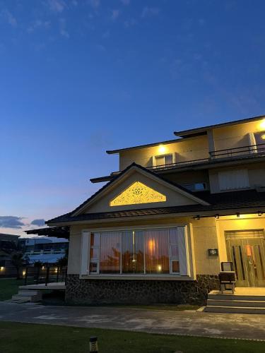 a building with a lit up front of it at 台東358民宿 in Taitung City