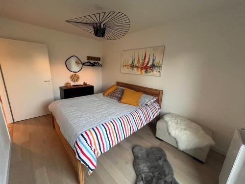 Ένα ή περισσότερα κρεβάτια σε δωμάτιο στο Calme et luxe dans une cité balnéaire