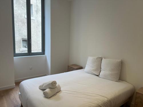 Postel nebo postele na pokoji v ubytování Le Chapelier