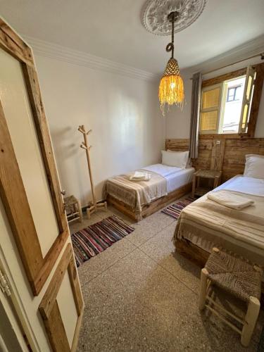 Postel nebo postele na pokoji v ubytování Grip Sea Morocco