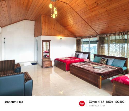 Ένα ή περισσότερα κρεβάτια σε δωμάτιο στο Malsha Bunglow