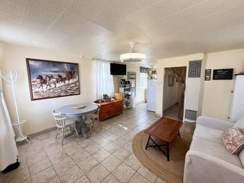 a living room with a couch and a table at The Cottage in Panguitch